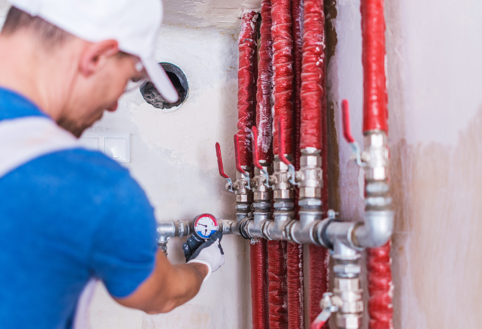 Plumber Checking on Water Supply